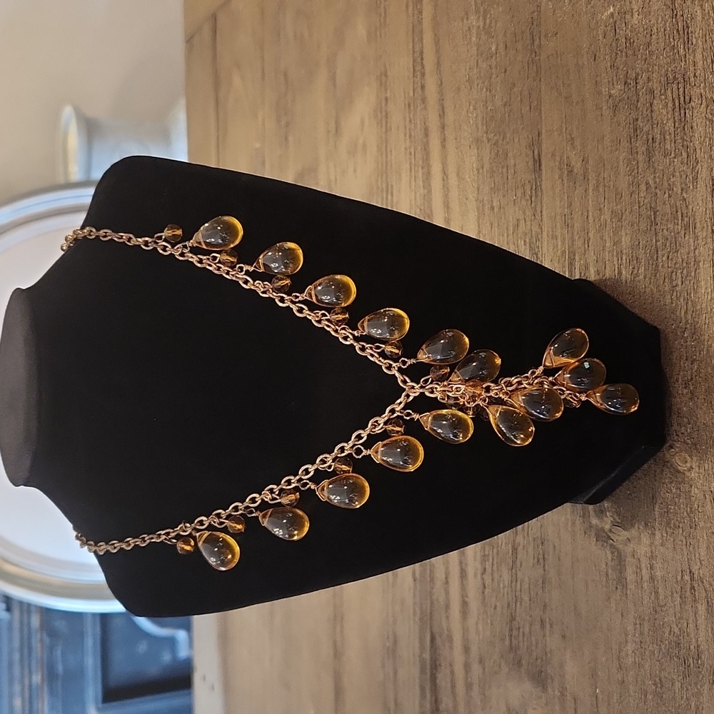 Beautiful amber color angel gold tone necklace.